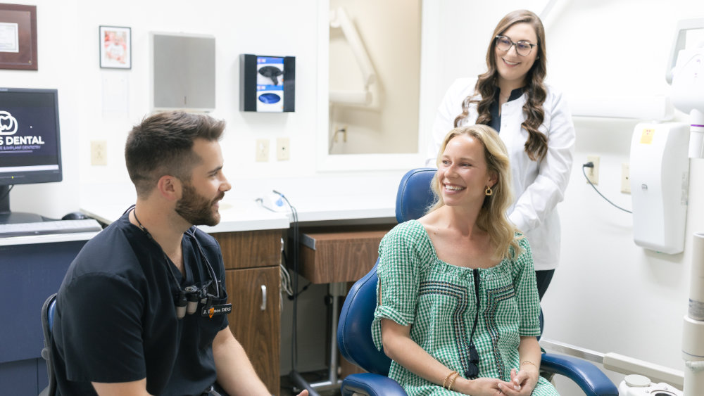 Dr. Jaden Danos consulting with patient alongside hygienist Halie at Danos Dental in Murfreesboro, TN