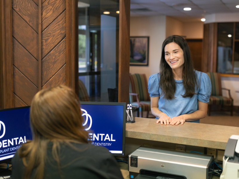 Front desk team welcoming patient at Danos Dental in Murfreesboro, TN